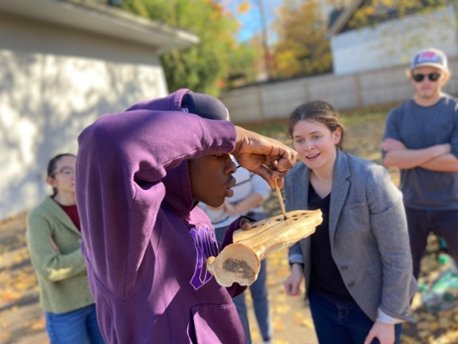 Professor watches student burn bone